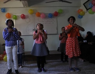 Faculty of Girls shares orphans their joy in the Arab Orphan Day